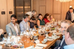 executives sitting around a roundtable for lunch at a restaurant